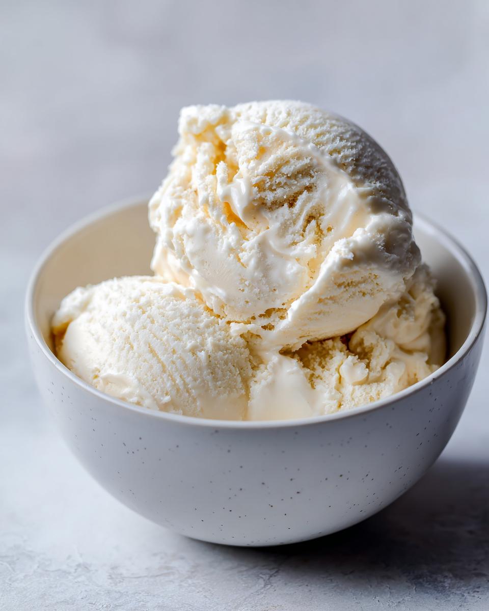 A bowl of creamy no-churn vanilla ice cream with condensed milk, ready to eat.
