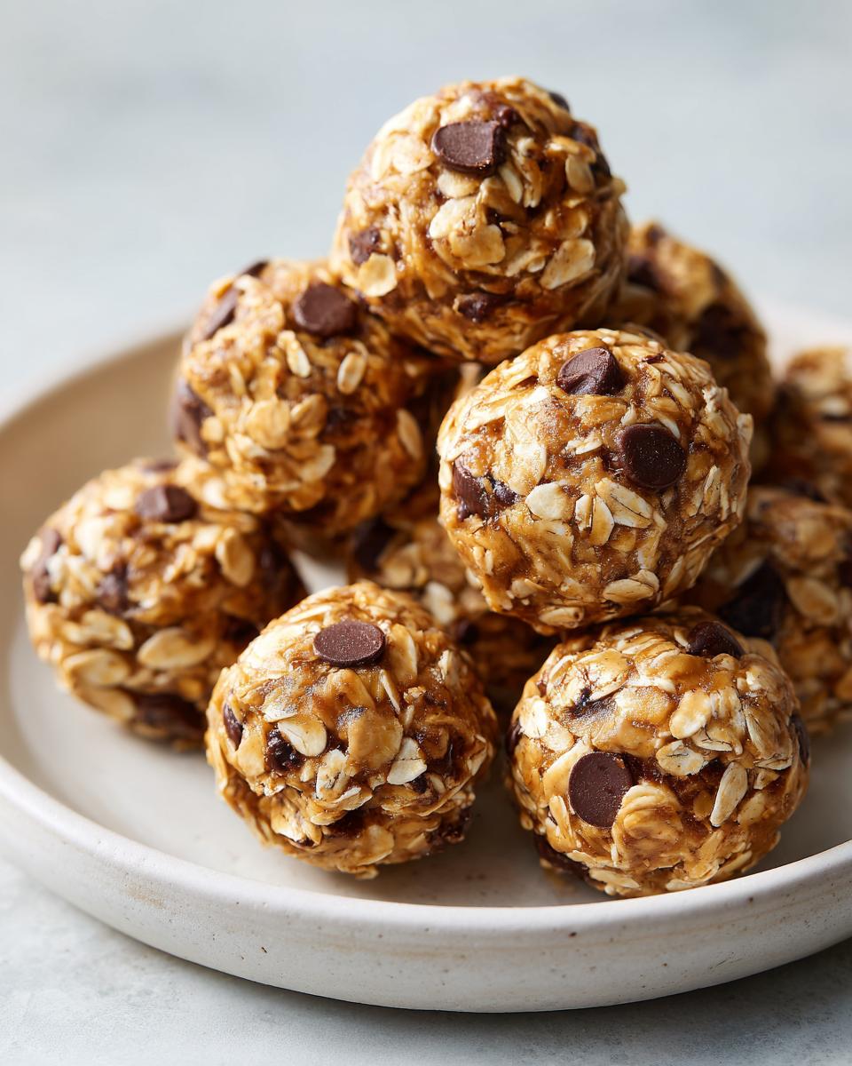 A stack of homemade Peanut butter oatmeal energy bites with chocolate chips on a plate.