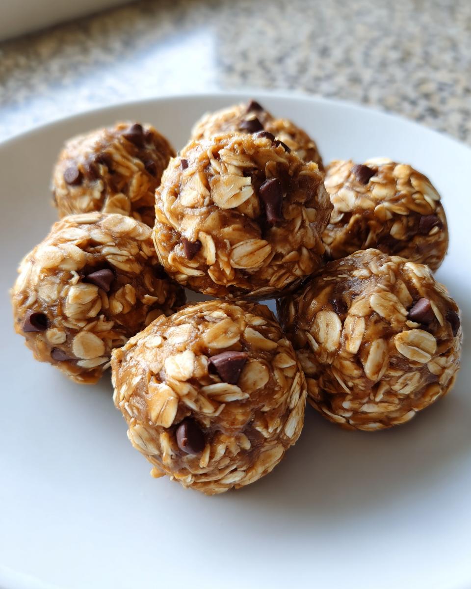 A plate of delicious No-Bake Oatmeal Energy Bites with oats and chocolate chips.